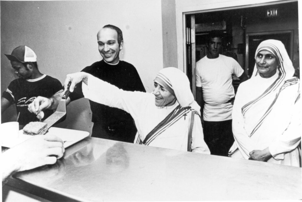 Then a Brother, Paul Johnson is pictured here with Mother Teresa of Calcutta serving at Camillus House.