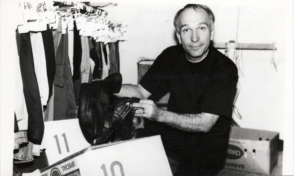 Paul Johnson sorting through clothing donations.