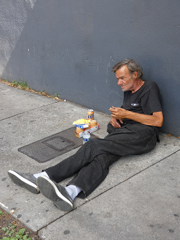 Homeless Man on Sidewalk