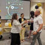 Former CEO Hilda Fernandez leans in for a hug with a Volunteer Appreciation recipient